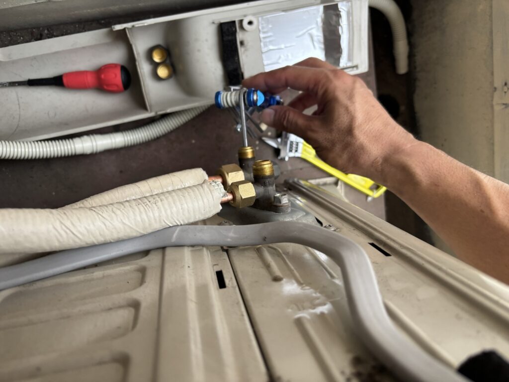 Opening an air conditioner service valve with a hex wrench
