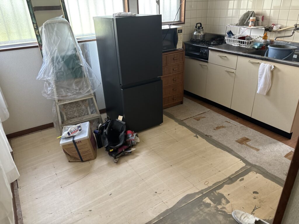 Kitchen before vinyl flooring installation in an occupied home