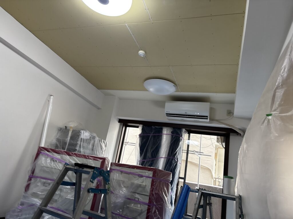 Newly installed plasterboard ceiling after water damage repair.