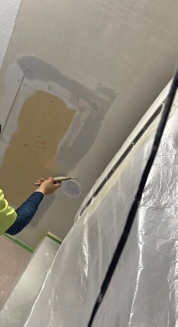 Applying joint compound to gypsum board joints before ceiling wallpaper installation