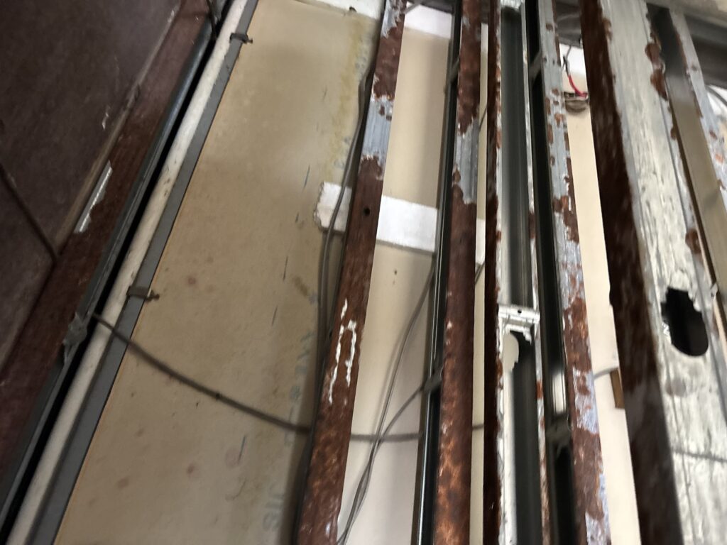 Mold and moisture damage inside the wall after drywall removal.