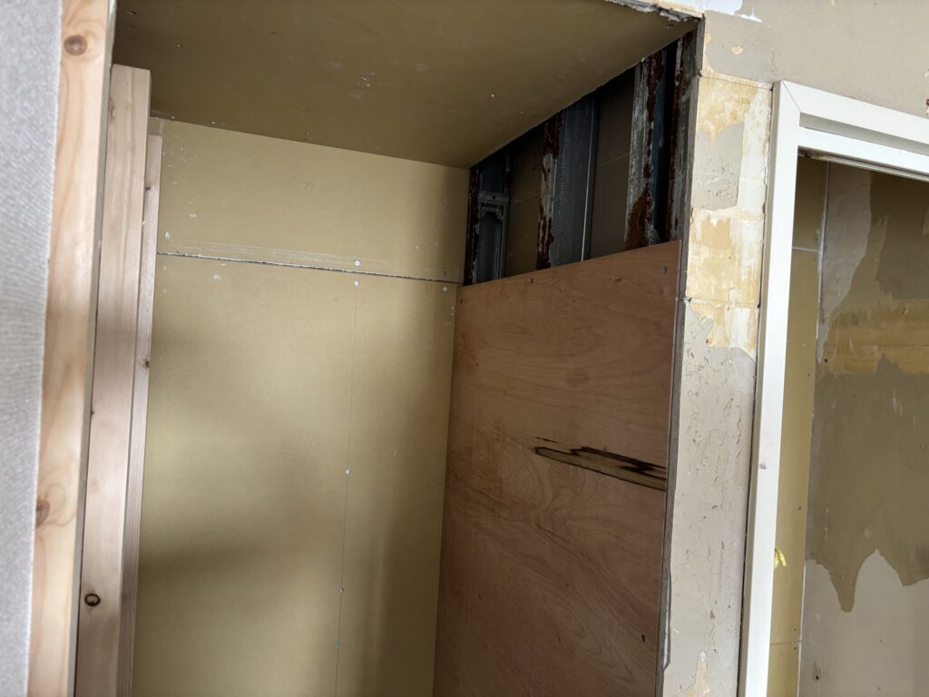 12 mm plywood installed inside a rebuilt storage shelf for future adjustable shelving.
