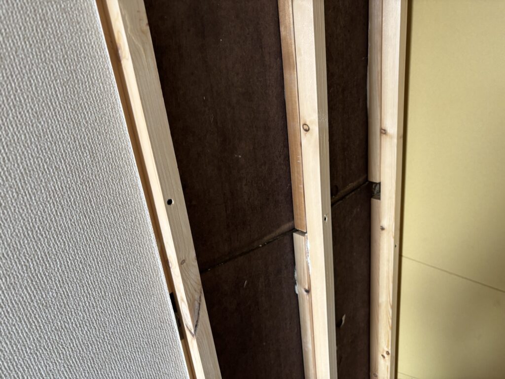 Installing new wood framing before rebuilding a damaged storage shelf.