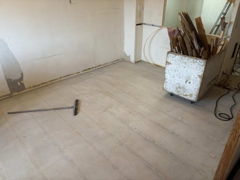 Living room floor after removing old flooring and underfloor heating