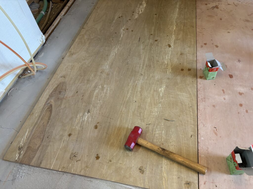 Approximately 1 mm gap between plywood sheets during subfloor installation