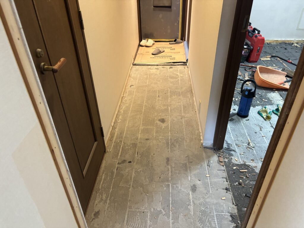 Hallway flooring being removed during a Japanese condominium renovation