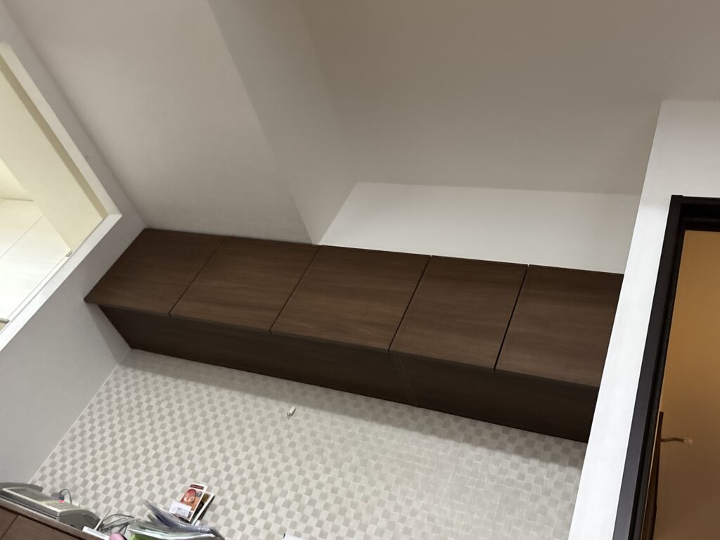 Finished wall with newly installed wallpaper in a fifth-floor Japanese condominium apartment.