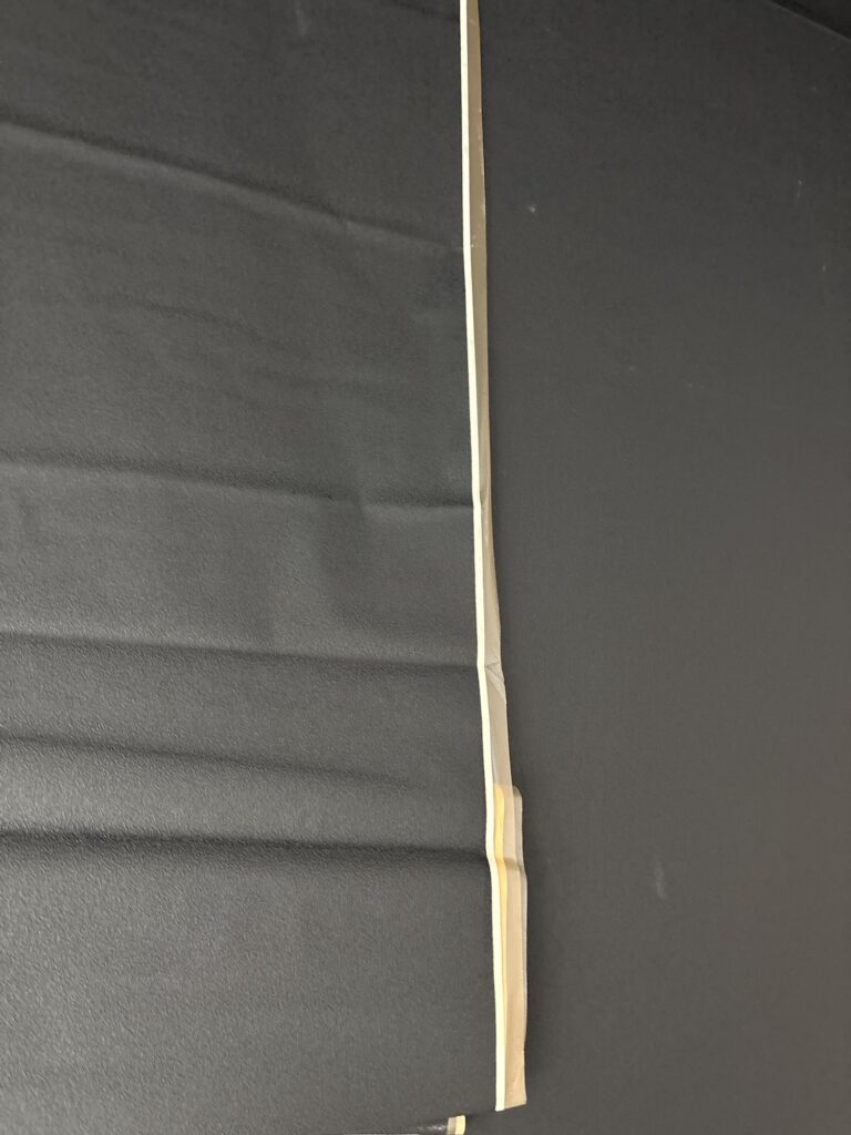 Installing thin black wallpaper on a gypsum board wall