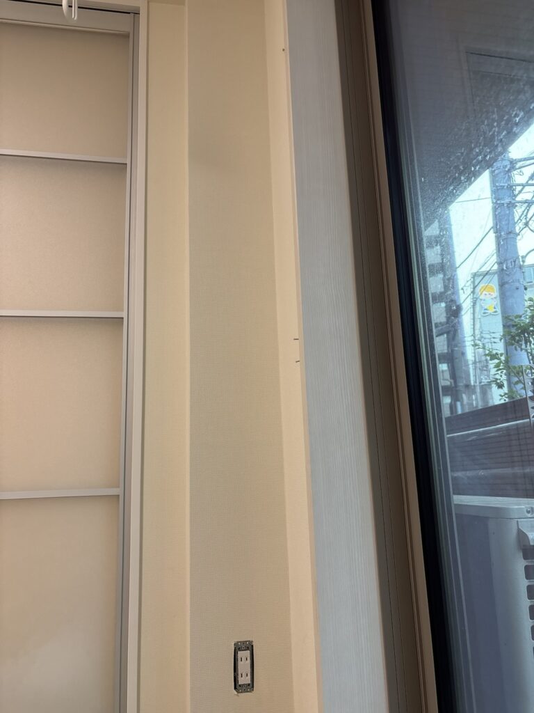 Narrow section of wall with newly replaced wallpaper in a 1LDK apartment