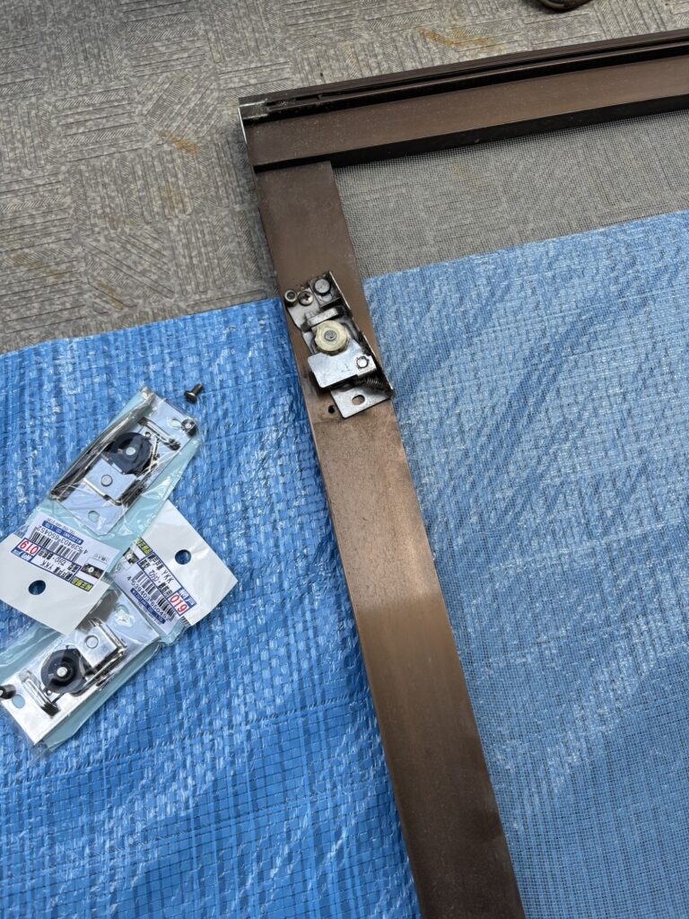 Replacing a worn roller on a Japanese sliding screen door to improve smooth operation