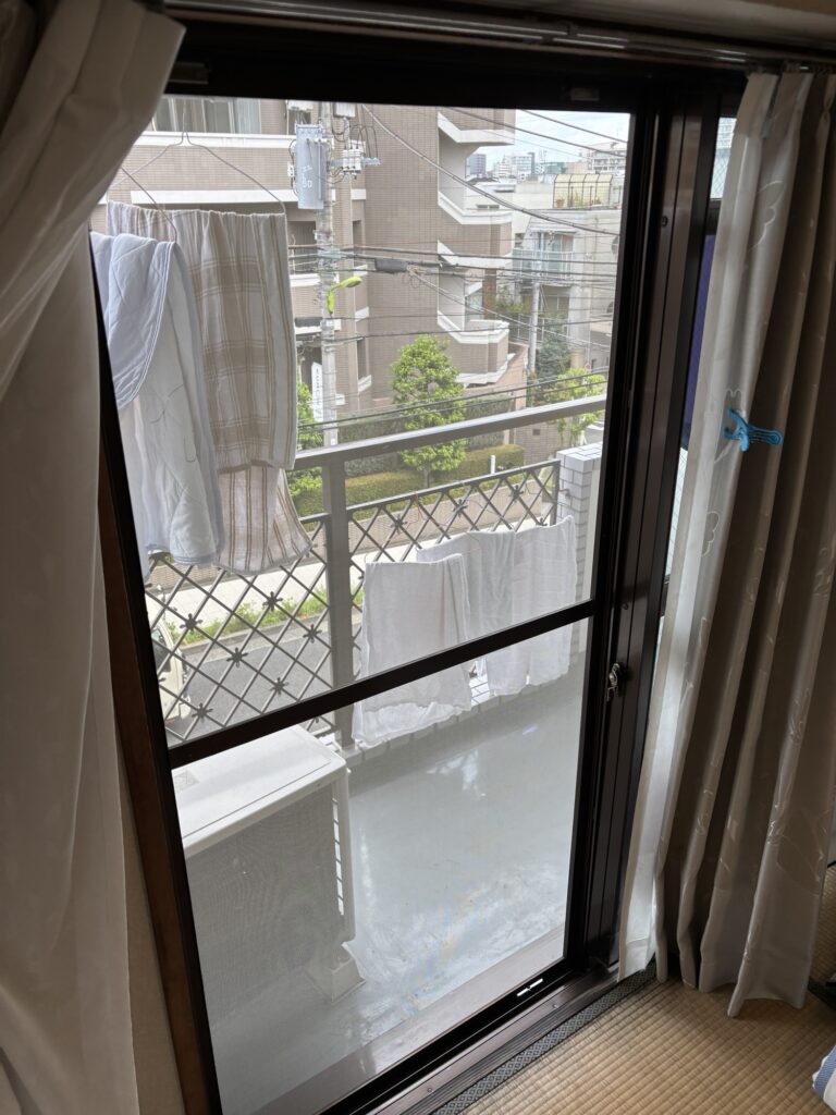 Completed Japanese sliding screen door with newly installed screen mesh and a tight, wrinkle-free finish