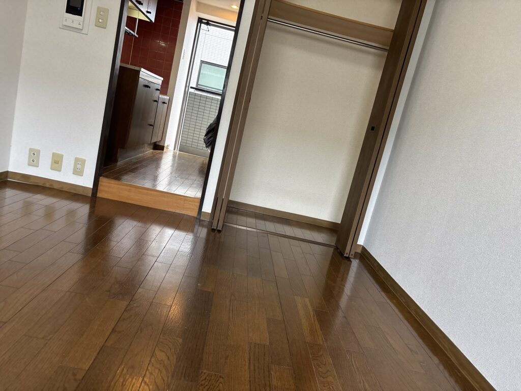 Existing wood flooring in the main room before cushion flooring installation.