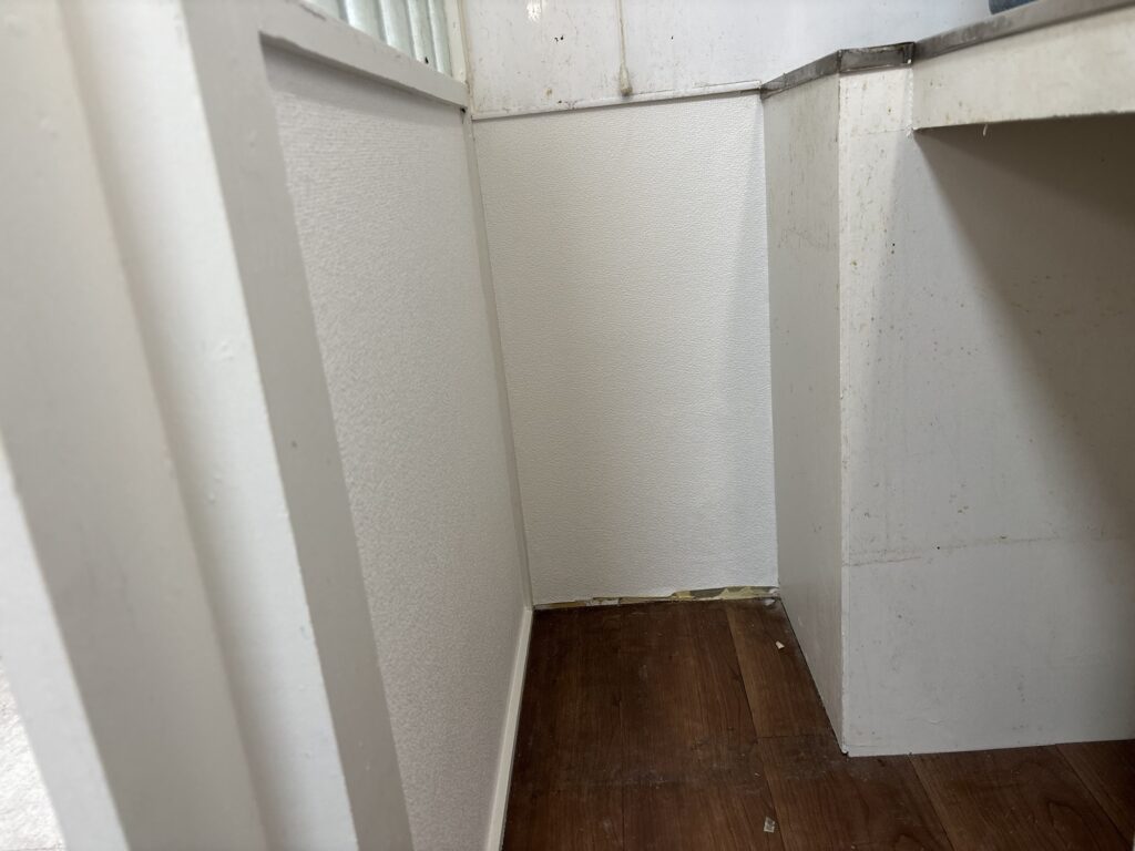 Wallpaper installed in a narrow kitchen area