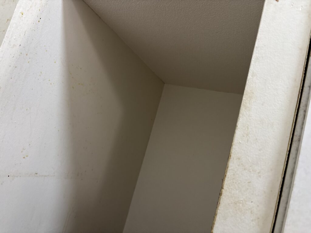Close-up of wallpaper installed in a narrow kitchen area