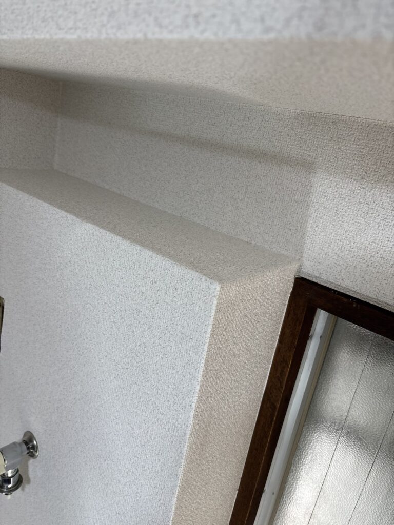 Top view of a square-shaped kitchen box after completing the wallpaper installation.