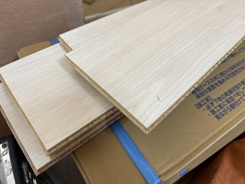 Close-up of the tongue edge of a wood flooring board used for a tongue-and-groove installation.