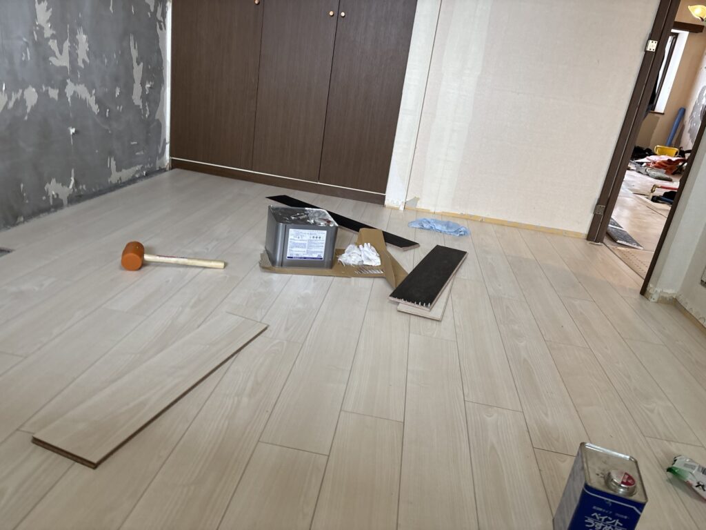 Finished wood flooring in a renovated bedroom of a Japanese apartment.
