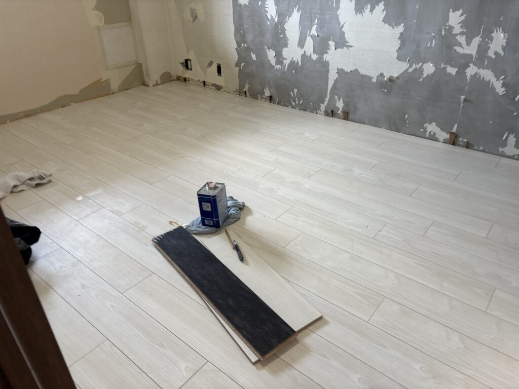 Completed wood flooring installation in a bedroom of a Japanese condominium apartment.