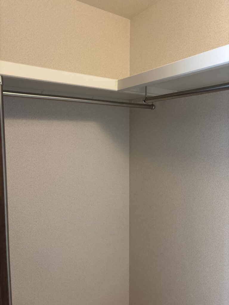 Completed new wallpaper installation inside a condominium walk-in closet.