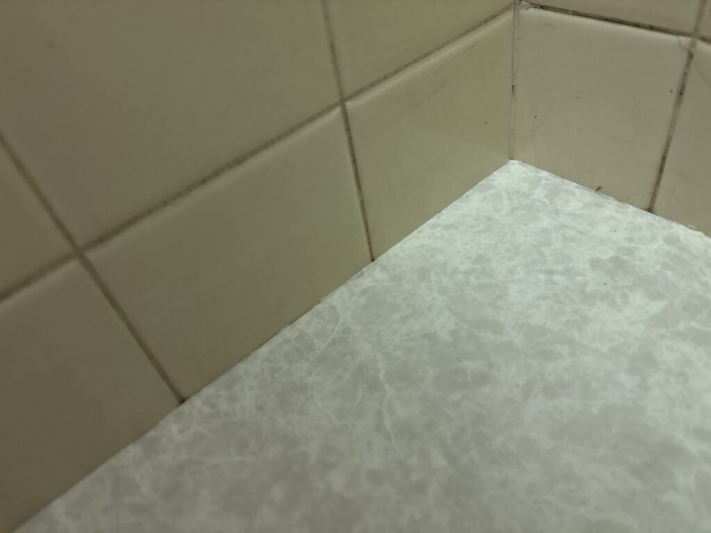 Cleanly trimmed cushion flooring around inside corners and wall edges