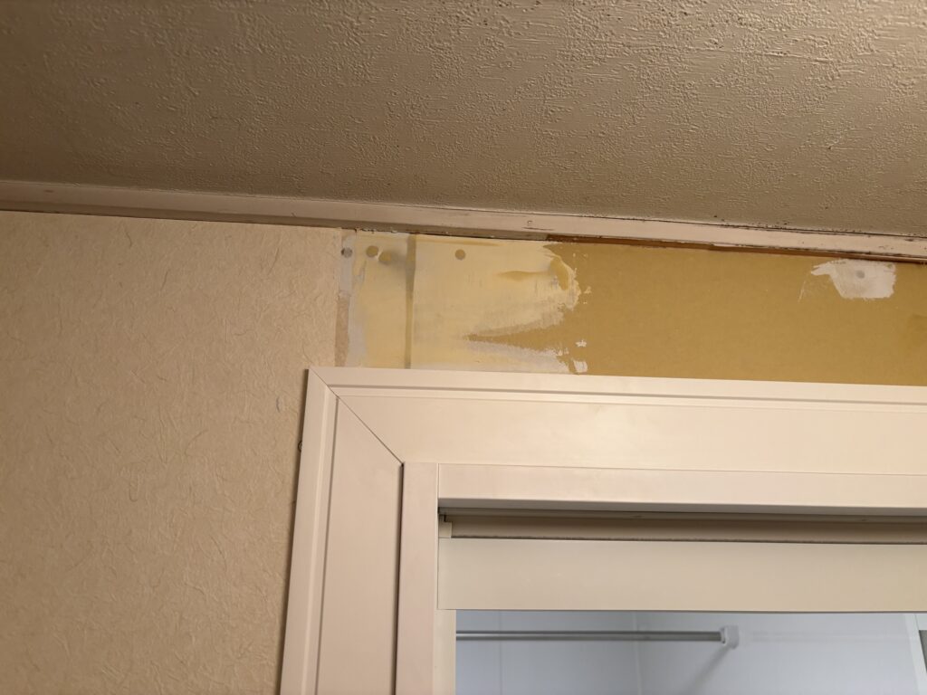 Finished joint compound surface ready for wallpaper installation on repaired gypsum board