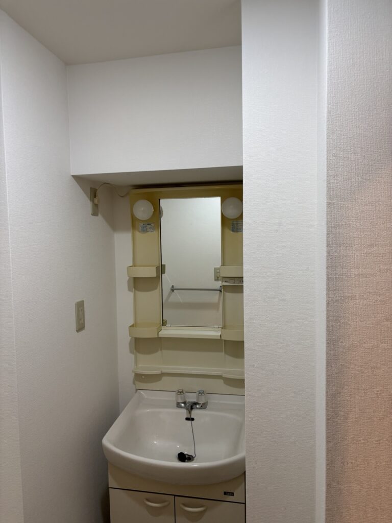 Completed washroom wallpaper replacement after repairing the damaged wall substrate