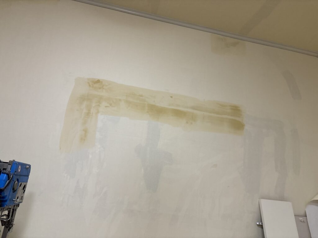 Finish putty applied to a wall before wallpaper installation