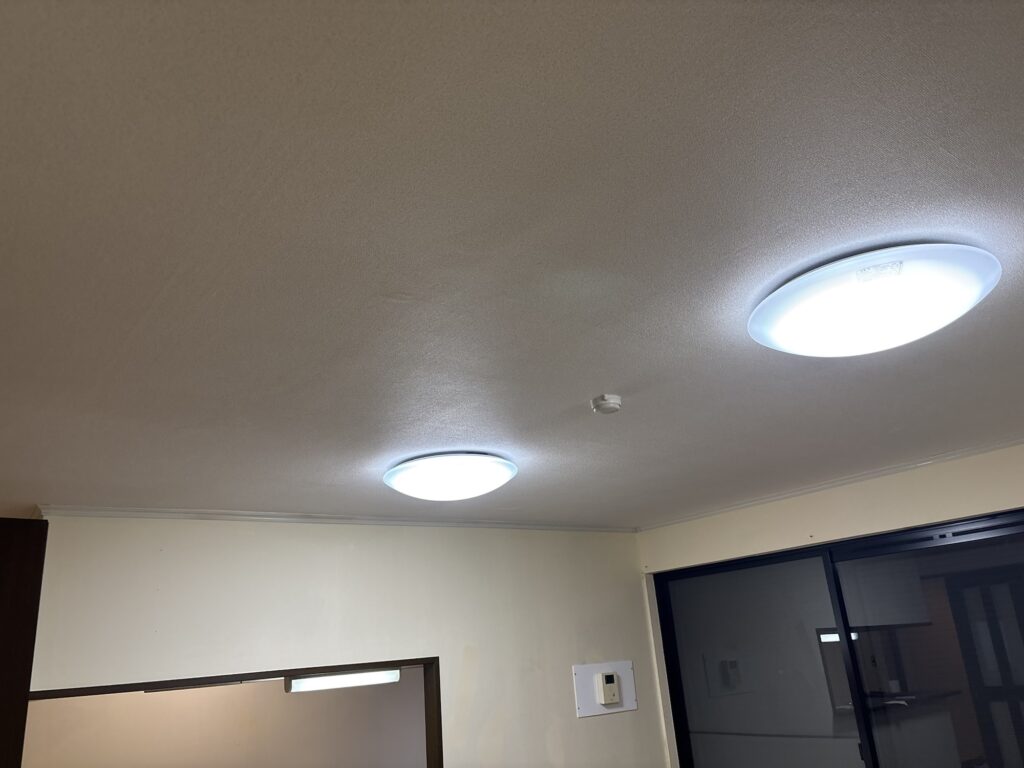 Completed living room and kitchen ceiling with new embossed wallpaper