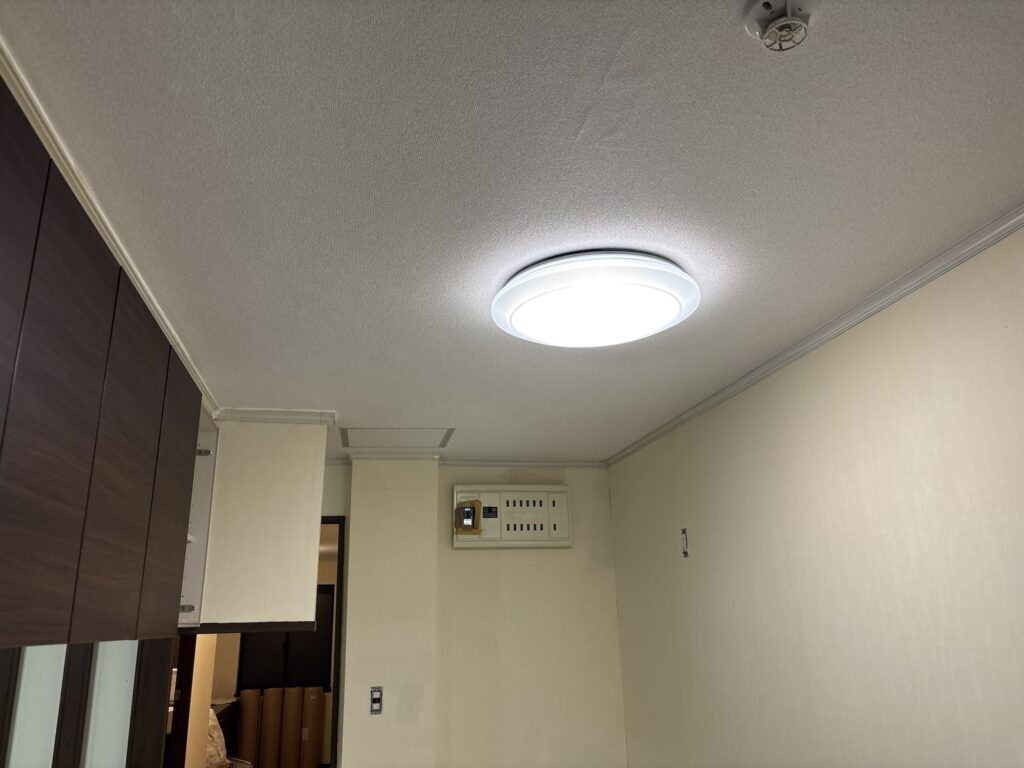 Completed kitchen ceiling with new embossed wallpaper