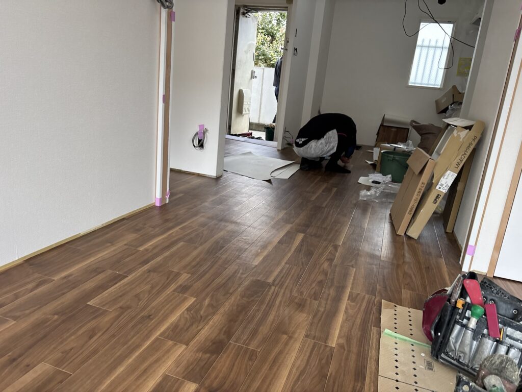 Seam sealer being applied to a cushion flooring joint during installation.