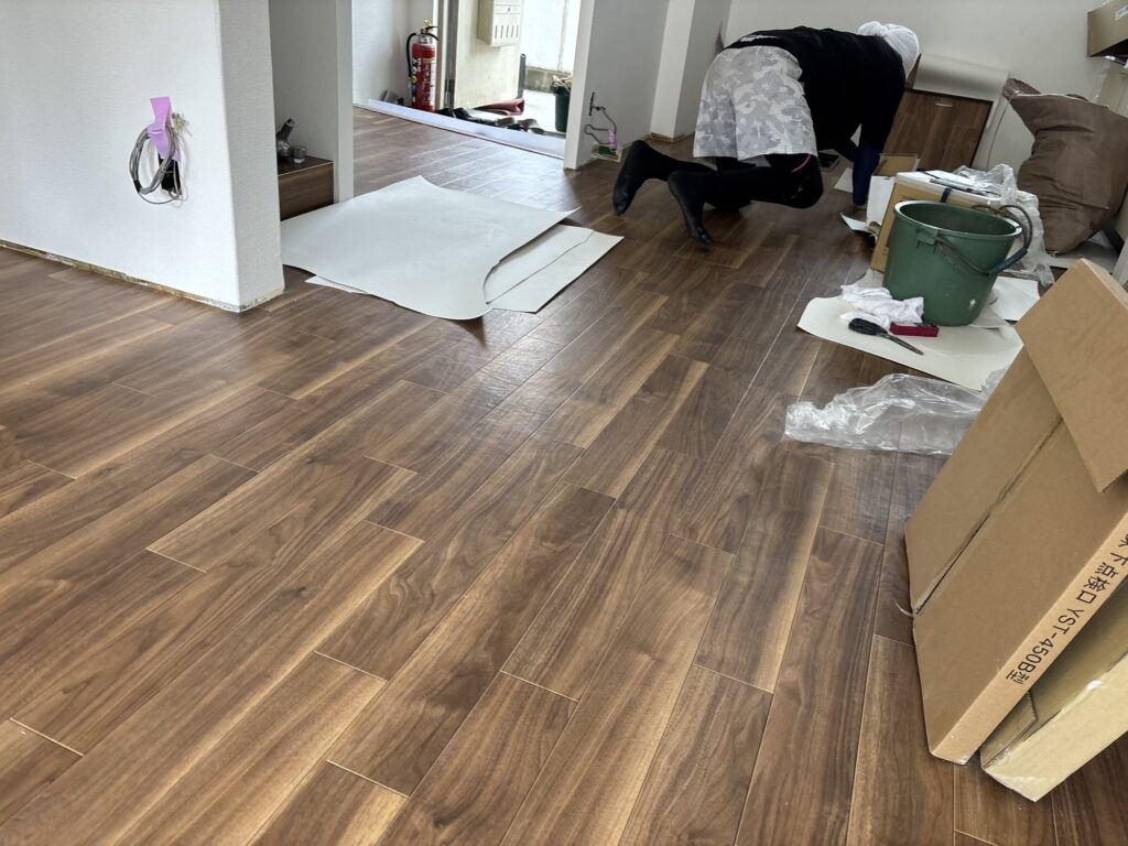 Finished wood-grain cushion flooring in the renovated living area.