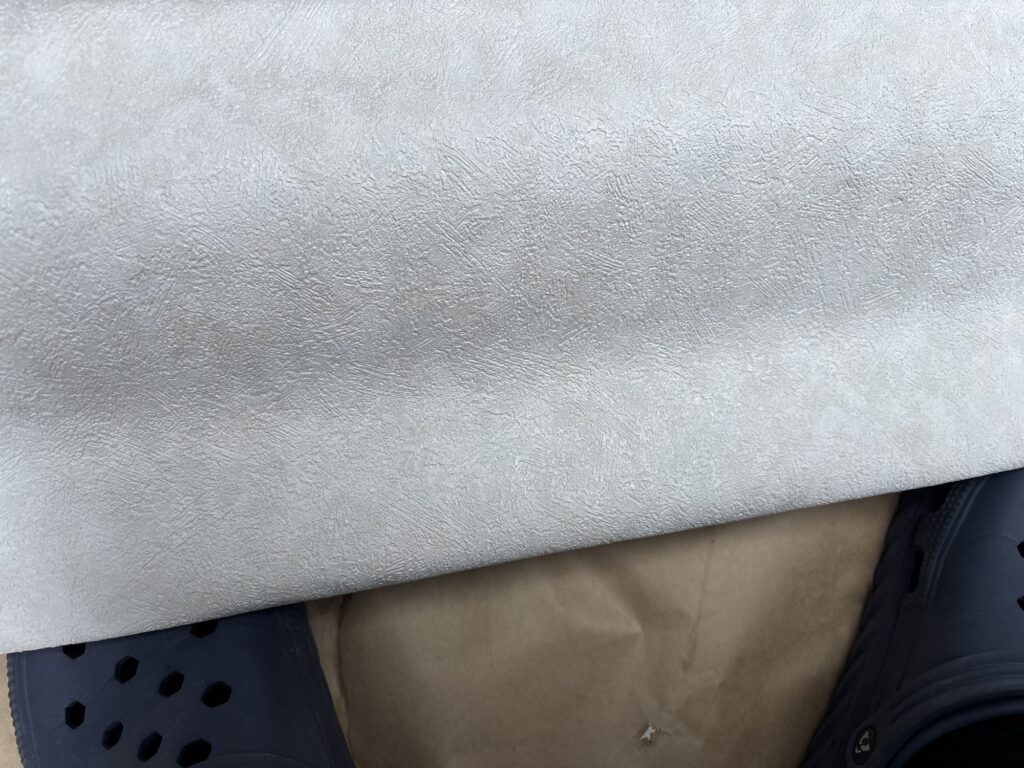 Stain-resistant wallpaper material prepared for the washroom walls