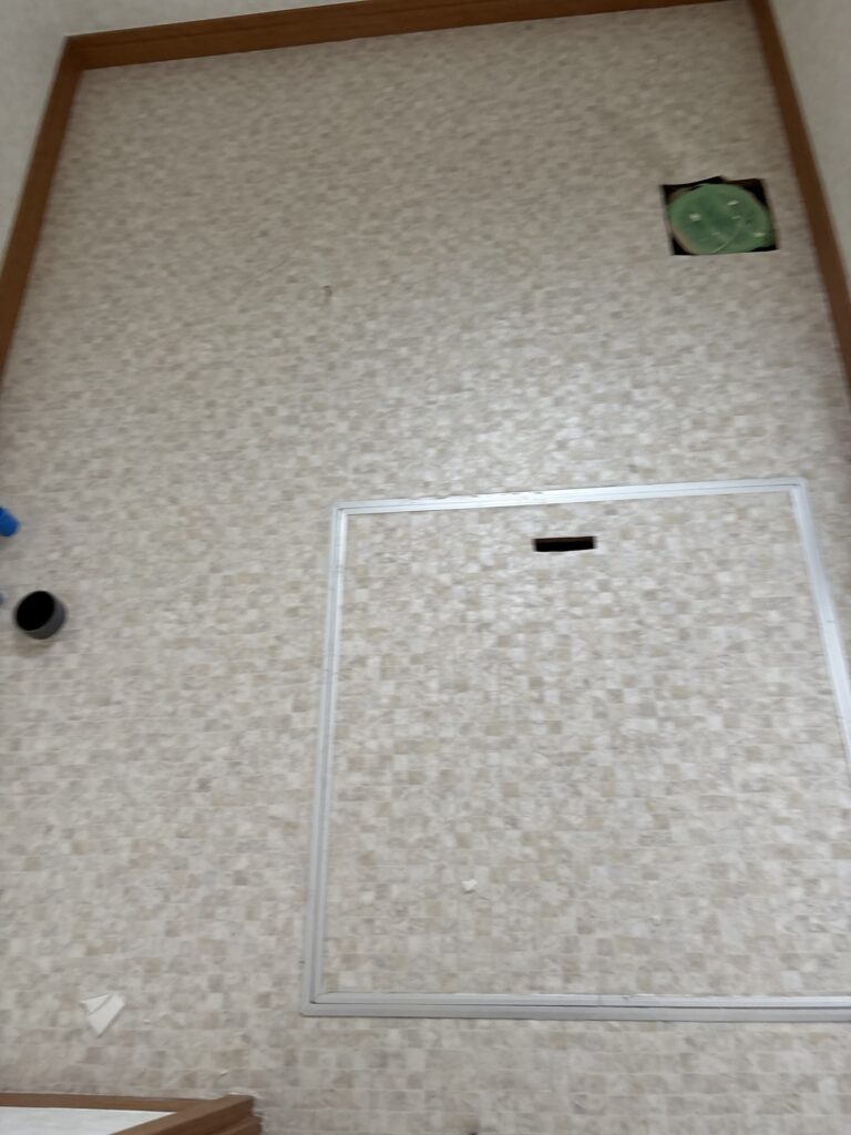 Completed cushion flooring installation in the renovated washroom