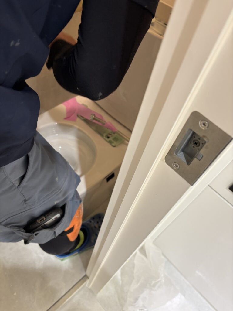 Securing the toilet water supply hose with tape before removal