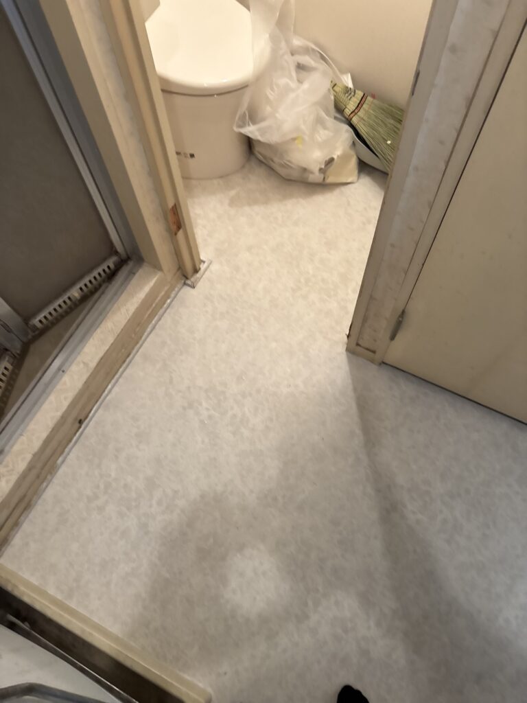 Completed cushion flooring with clean edges and a finished joint