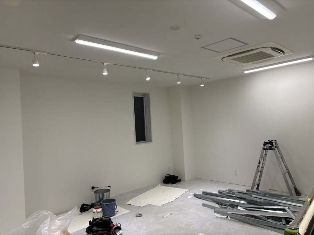 Finished wall wallpaper installation in a commercial interior on the sixth floor of an eight-story building in Tokyo, Japan.