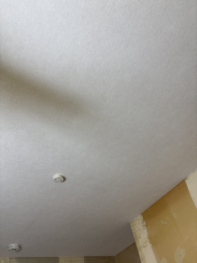 Completed new wallpaper installation on the ceiling of a kitchen in a Japanese detached house.