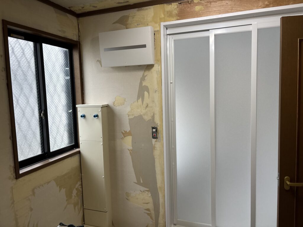 Original washroom condition before wallpaper and cushion flooring installation.