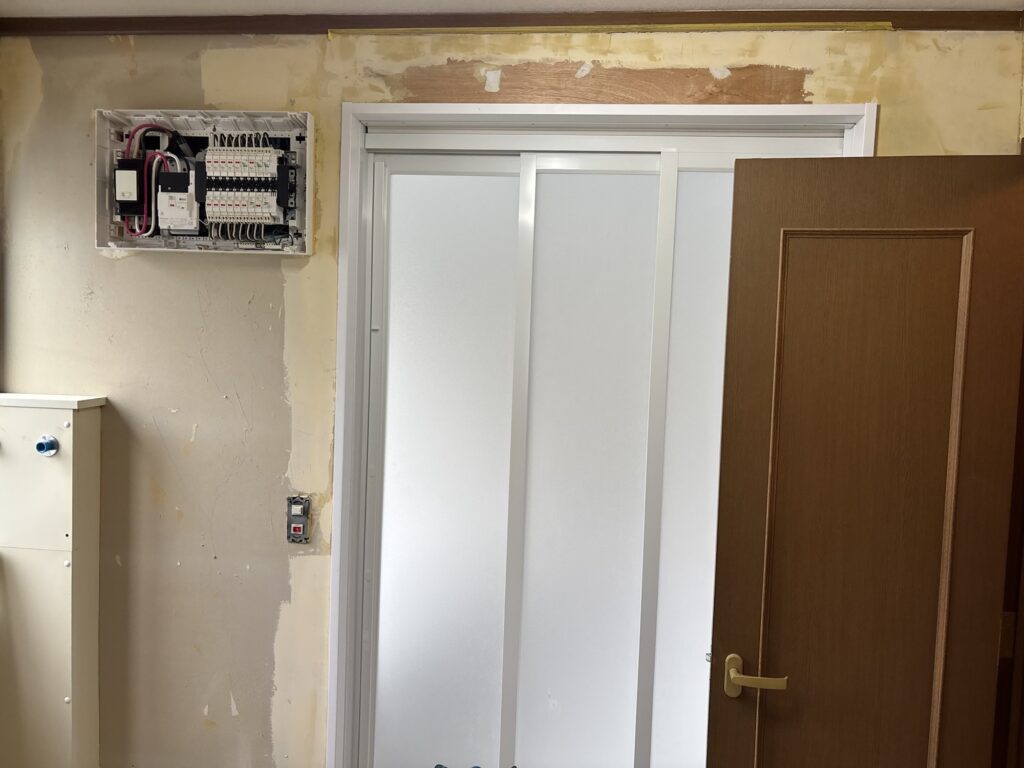 Washroom before wallpaper and cushion flooring renovation in a Japanese detached house.
