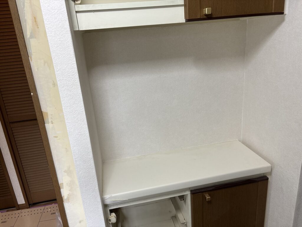 Finished wallpaper around a cabinet in a Japanese washroom.