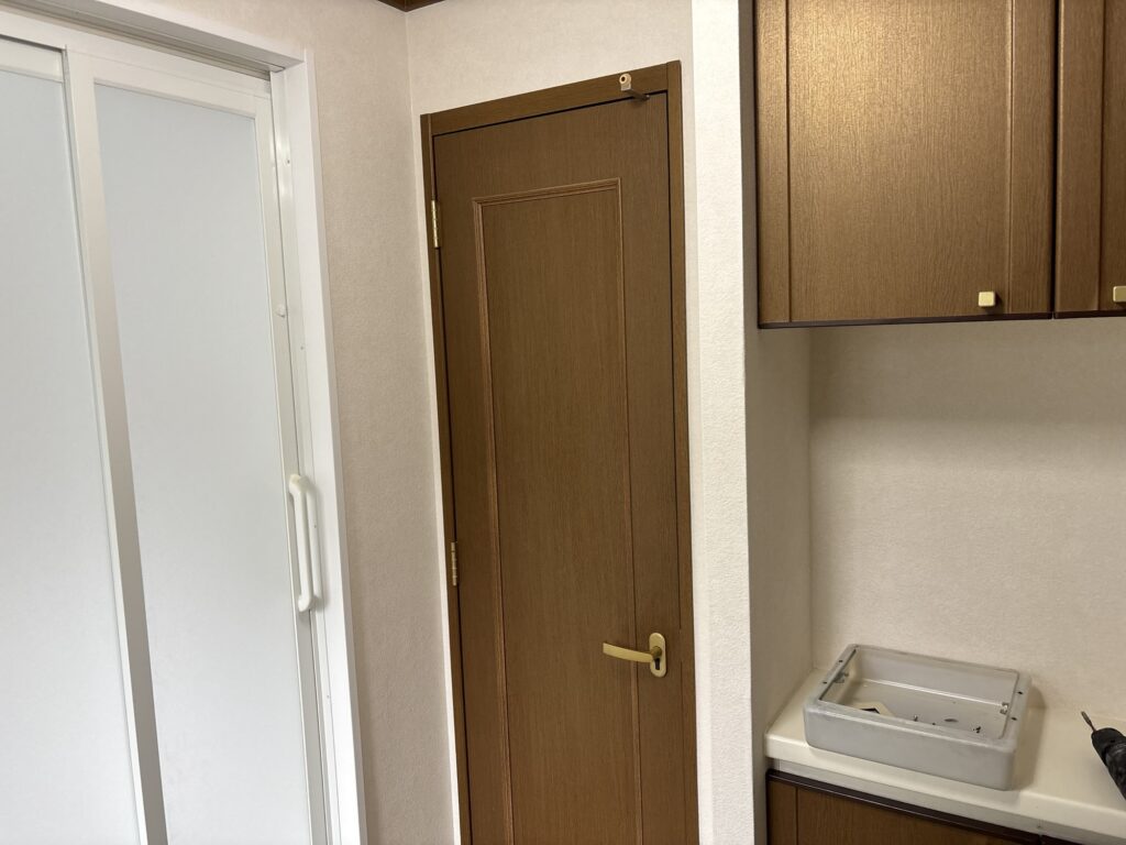 Completed wallpaper installation in a renovated Japanese washroom.