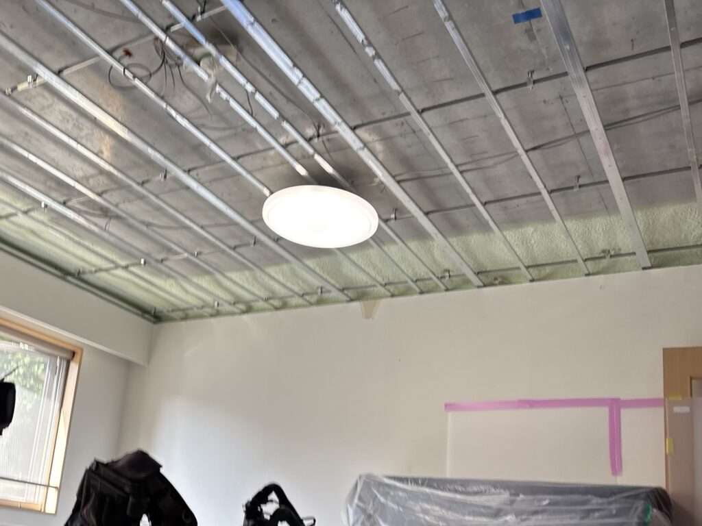 Interior of a vacant apartment in Japan before wallpaper and ceiling renovation work.