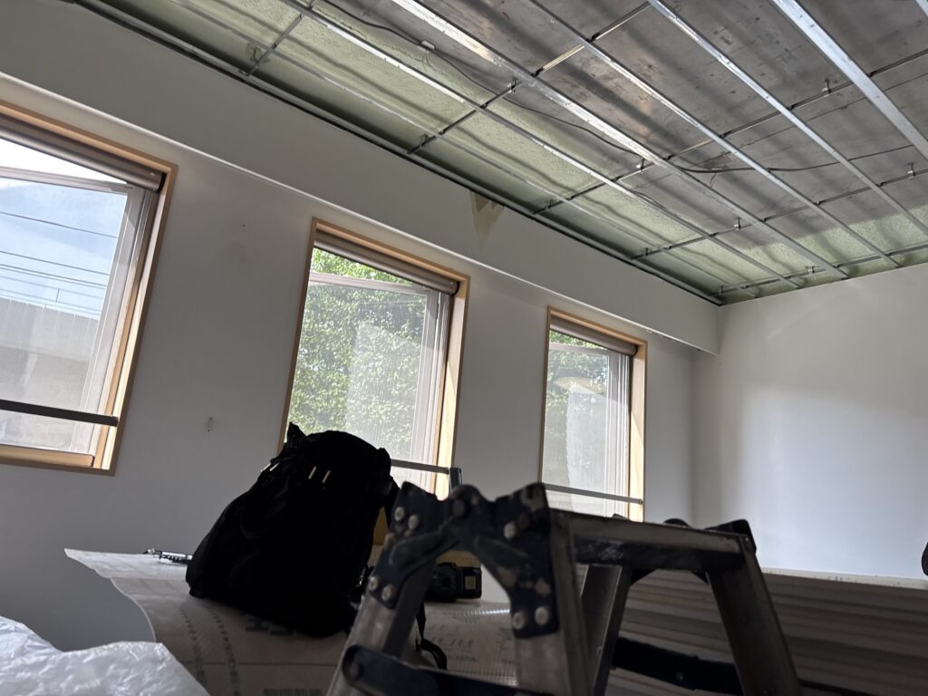 Existing interior of a 2LDK apartment before ceiling, wall, and flooring preparation.