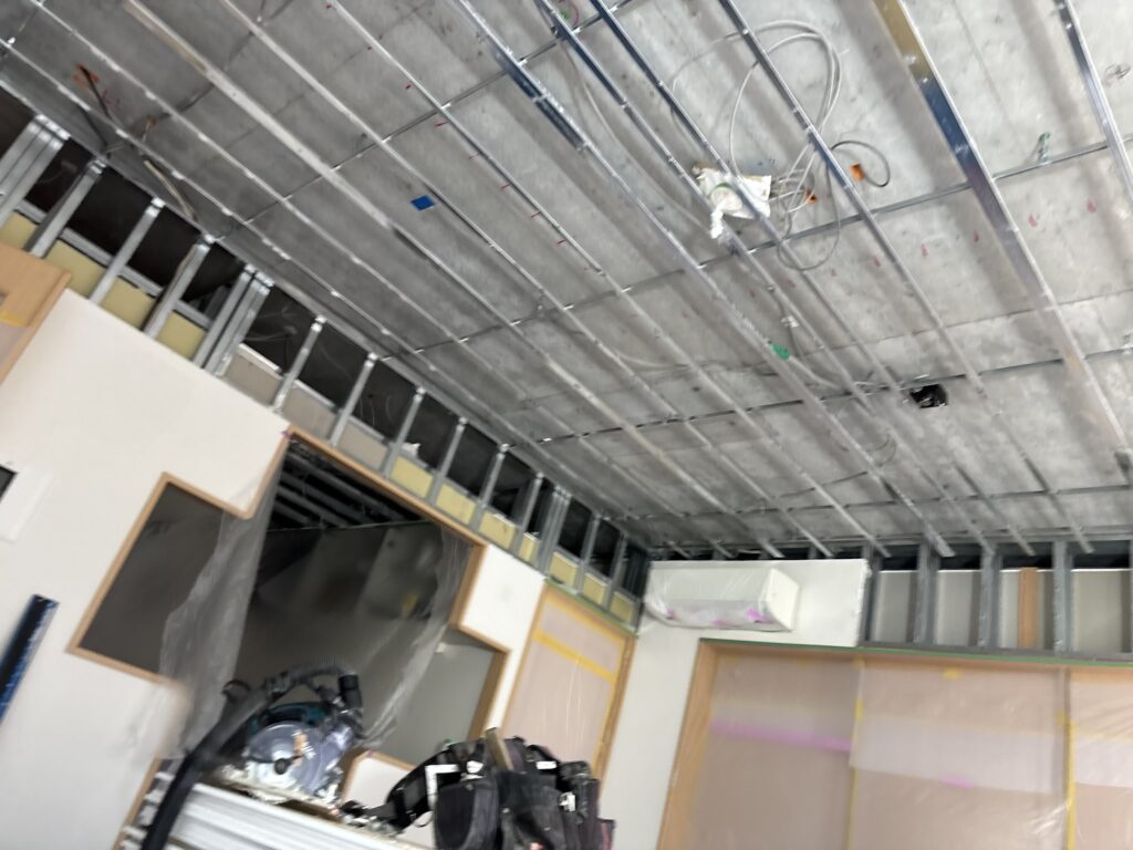 Apartment interior before renovation, showing the existing walls and ceiling.