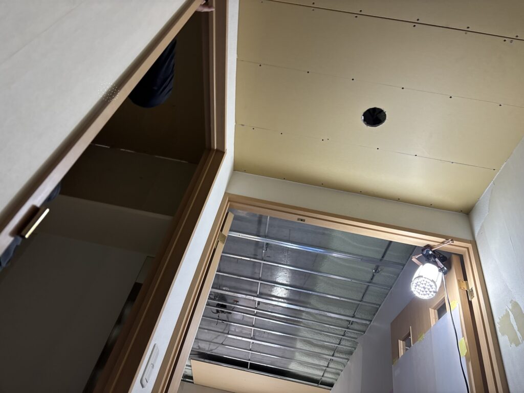 Newly installed gypsum boards on the entrance ceiling of an apartment in Japan.